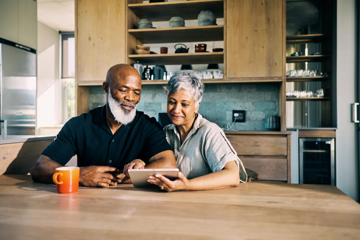 An elderly couple is reviewing their retirement plan.