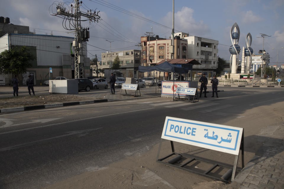 Members of Palestinian Hamas police stand guard at a checkpoint in Gaza City, Thursday, Nov. 25, 2021. Gaza’s Hamas rulers collect millions of dollars a month in taxes and customs at a crossing on the Egyptian border – providing a valuable source of income that helps it sustain a government and powerful armed wing. After surviving four wars and a nearly 15-year blockade, Hamas has become more resilient and Israel has been forced to accept that its sworn enemy is here to stay. (AP Photo/ Khalil Hamra)