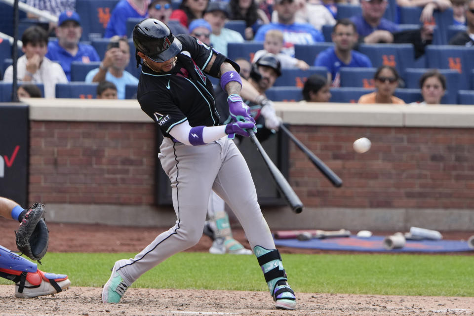 Arizona Diamondbacks' Ketel Marte hits a two-run home run during the ninth inning of a baseball game against the New York Mets at Citi Field, Sunday, June 2, 2024, in New York. (AP Photo/Seth Wenig)