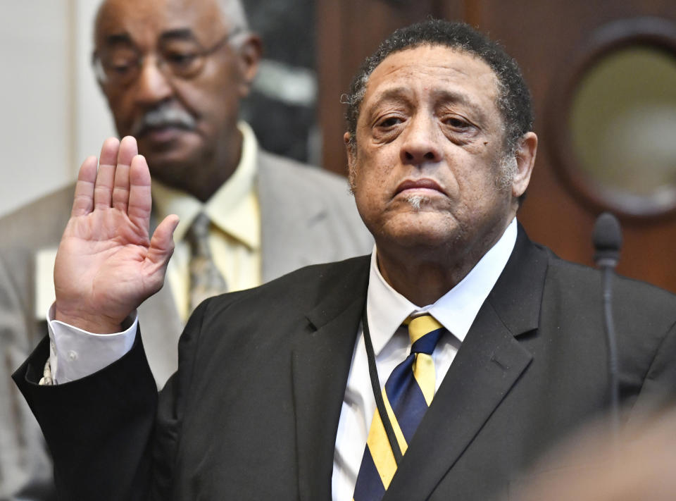 FILE - In this Jan. 8, 2019, file photo, incoming state Rep. Jim Glenn, D-Owensboro, is sworn in during a ceremony at the Kentucky House of Representatives in Frankfort, Ky. A recount in a Kentucky legislative race that resulted in a tie drew a quick response Monday, Feb. 4, 2019, from an attorney who claimed Republican candidate DJ Johnson and his attorney improperly pressured election officials to give Johnson an additional vote in the race against Glenn. (AP Photo/Timothy D. Easley, File)