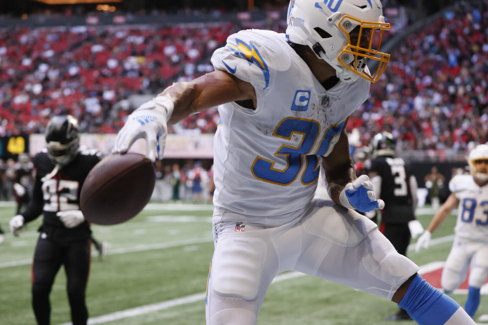 CORRECTS DATE TO SUNDAY, NOV. 6 INSTEAD OF TUESDAY, DEC. 6 - Los Angeles Chargers running back Austin Ekeler celebrates after catching a 1-yard touchdown pass during the first half of an NFL football game against the Atlanta Falcons, Sunday, Nov. 6, 2022, in Atlanta. (AP Photo/Butch Dill)