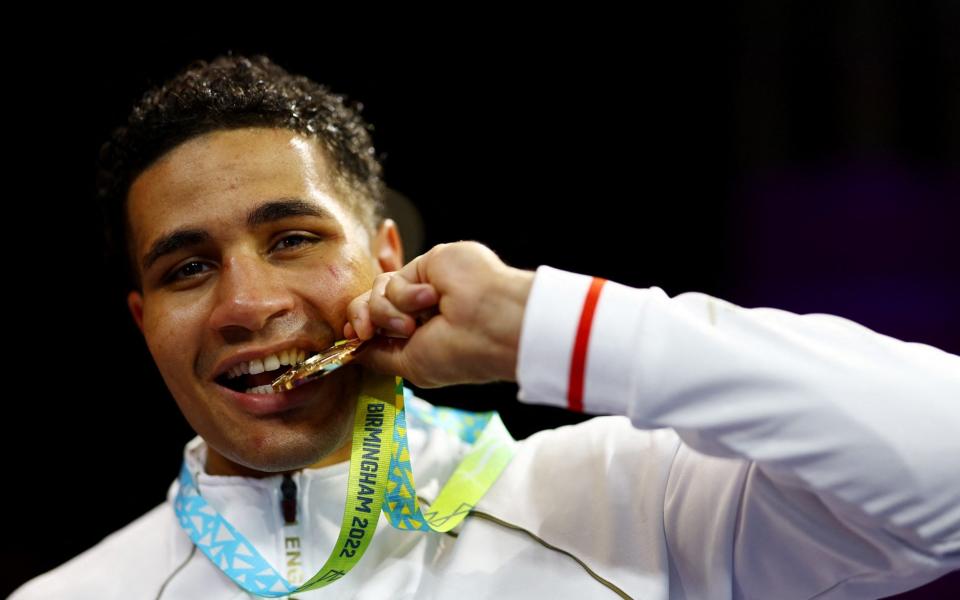 Commonwealth Games - Boxing Menâ€™s Over 92kg (Super Heavyweight) - Medal Ceremony - The NEC Hall 4, Birmingham, Britain - August 7, 2022 Gold medallist England's Delicious Orie celebrates on the podium during the medal ceremony - REUTERS