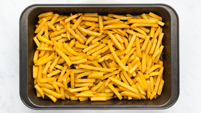 French fries on baking sheet