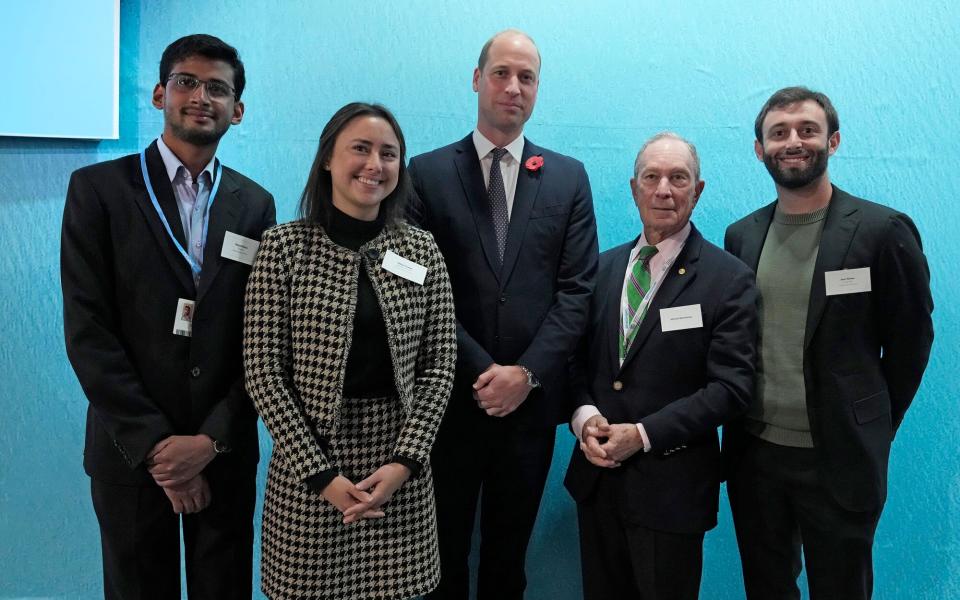 Prince William, Duke of Cambridge (C) and U.S. businessman Michael Bloomberg (2nd R), stand with Earthshot prize winners and finalists (from L) Vidyut Mohan for Clean Air, Vaitea Cowan for Fix our Environment and Sam Teicher for Revive our Oceans at the Glasgow Science Center on the sidelines of the COP26 U.N. Climate Summit on November 2, 2021 in Glasgow, United Kingdom. 2021 sees the 26th United Nations Climate Change Conference. The conference will run from 31 October for two weeks, finishing on 12 November. It was meant to take place in 2020 but was delayed due to the Covid-19 pandemic.