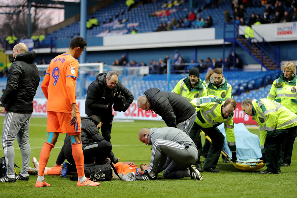 Cardiff City's Joe Bennett requires medical assistance as he lays injured