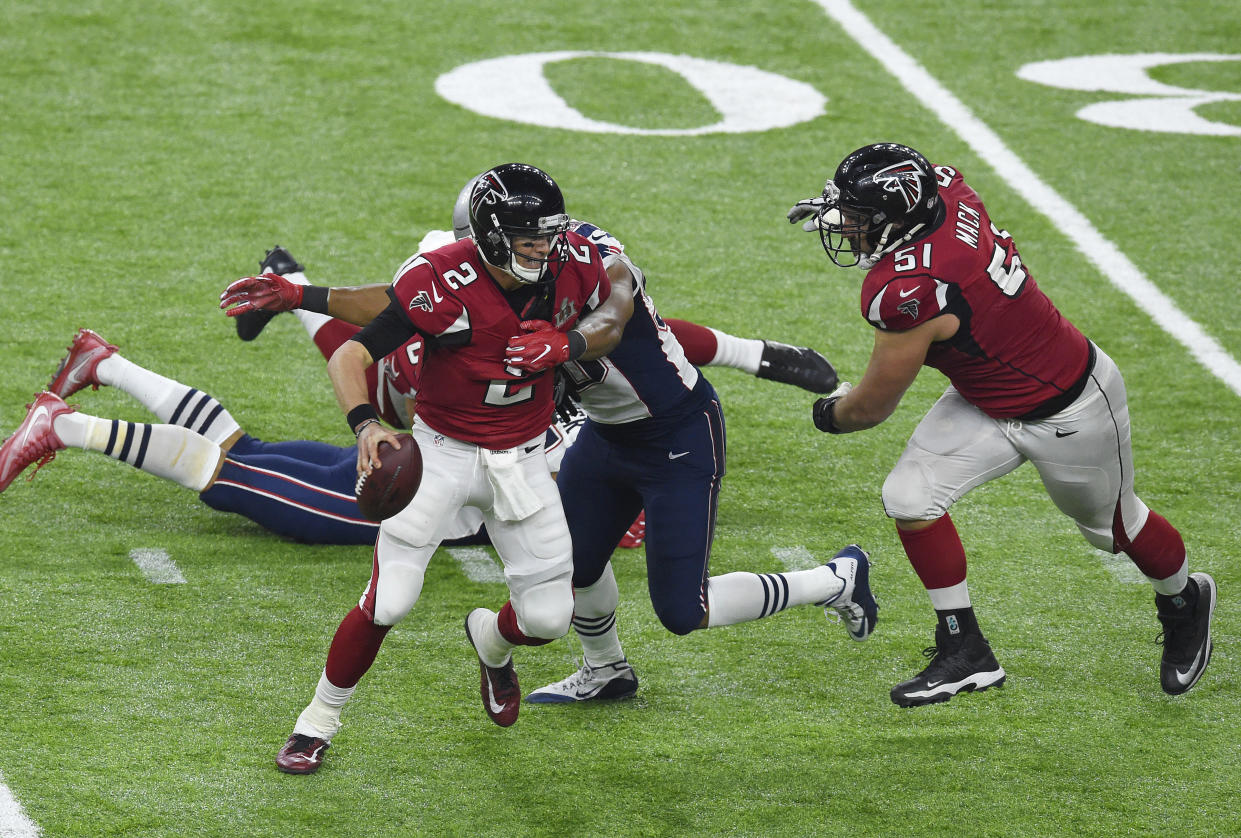 HOUSTON, TX - FEBRUARY 05: Matt Ryan #2 of the Atlanta Falcons drops back to pass under pressure from Trey Flowers #98 of the New England Patriots during Super Bowl 51 at NRG Stadium on February 5, 2017 in Houston, Texas. The Patriots defeat the Atlanta Falcons 34-28 in overtime. (Photo by Focus on Sport/Getty Images)