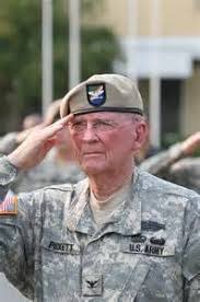 Ret. Col. Ralph Puckett salutes in uniform