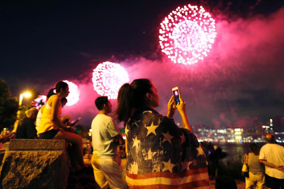 People watch a fireworks show in Queens, New York (Eduardo Munoz Alvarez/AFP/Getty)