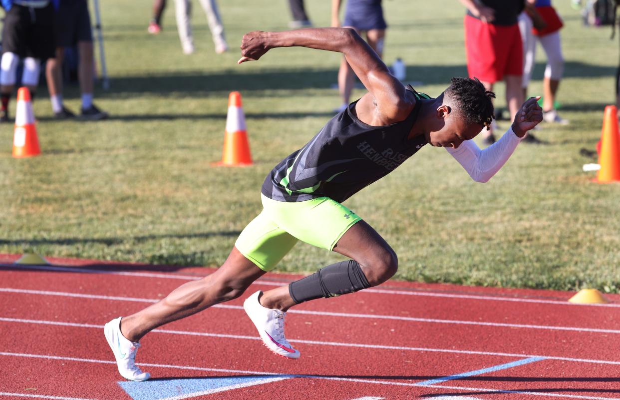 Rush-Henrietta's OJ Singletary starting 400 meter dash during the 2021 high outdoor track and field season.