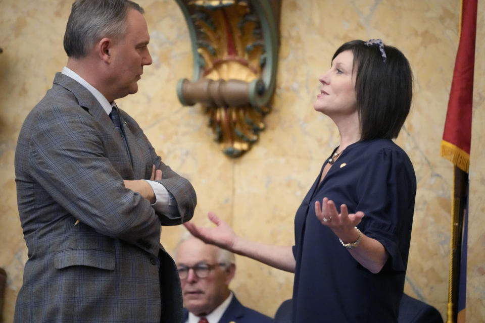 Mississippi House Medicaid Committee Chairman Rep. Missy McGee, R-Hattiesburg, right, gestures as she confers with House Speaker Rep. Jason White, R-West, at the state Capitol in Jackson, Miss., Thursday, May 2, 2024. (AP Photo/Rogelio V. Solis)