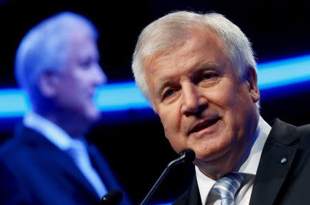Bavarian Prime Minister and head of the Christian Social Union (CSU) Horst Seehofer gives a speech during a CSU party congress in Munich, Germany November 21, 2015. REUTERS/Michael Dalder