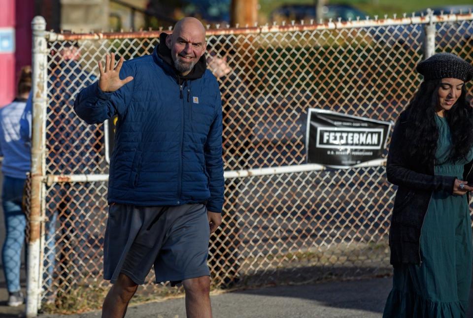 BRADDOCK, PA - NOVEMBER 08: Pennsylvania Democratic Senate candidate John Fetterman and his wife, Gisele, walk into their polling place to cast their votes at the New Hope Baptist Church on November 8, 2022 in Braddock, Pennsylvania. (Getty Images)