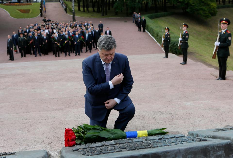 On Sept. 29, 2014, then-Ukrainian President Petro Poroshenko attends a ceremony at the monument to Jewish victims of Nazi massacres in Ukraine's capital Kyiv. The ceremony commemorated the 73th anniversary of the Nazi massacre of Jews at the Babi Yar ravine, where at least 33,770 Jews were killed over a 48-hour period on Sept. 29, 1941.