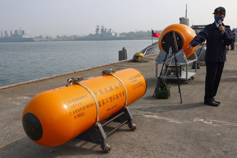 A Navy officer introduces a mine during a drill ahead of the Lunar New Year in Kaohsiung,