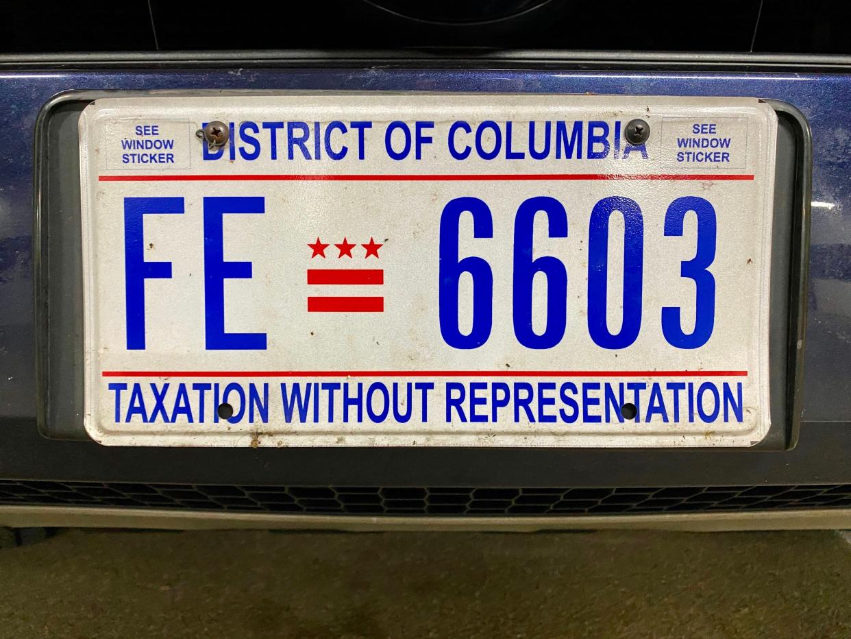 A D.C. license plates bear the phrase "Taxation Without Representation," repurposing the popular rallying cry of the American Revolution to note that D.C. residents pay more in federal income taxes than residents of 22 states, but do not enjoy the representation that comes with statehood. (Photo: DANIEL SLIM via Getty Images)