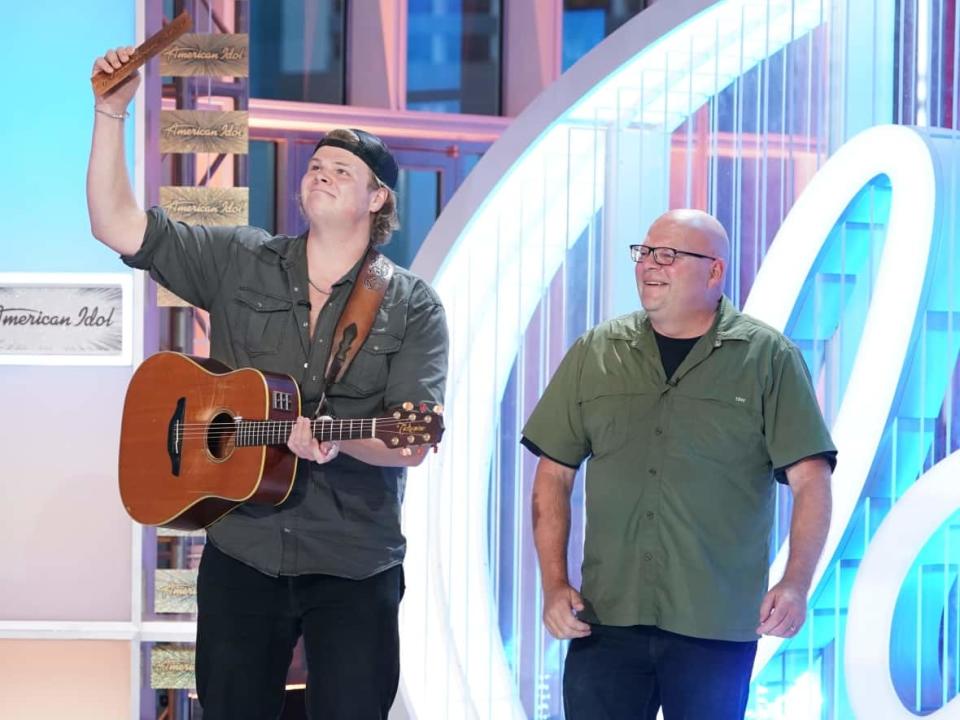 Brayden King, left, and his dad Greg on the American Idol stage. (Supplied by Brayden King - image credit)