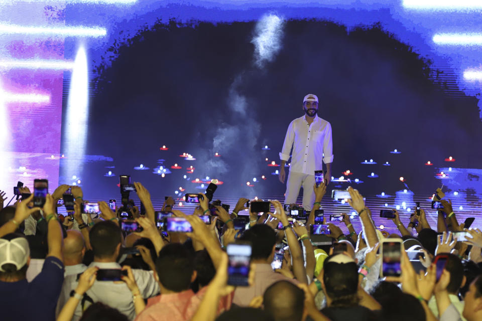 El Salvador's President Nayib Bukele participates in the closing ceremony of a congress for cryptocurrency investors in Santa Maria Mizata, El Salvador, Saturday, Nov. 20, 2021. Bukele announced during the rock concert-like atmosphere at the gathering that his government will build an oceanside "Bitcoin City" at the base of a volcano. (AP Photo/Salvador Melendez)