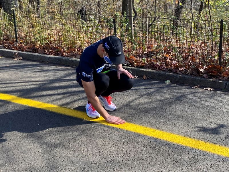 Thomas Panek, a blind runner and CEO of Guiding Eyes for the Blind, gets ready for a 5K run in Central Park where he will use Google's "Guideline" app instead of help from a human or guide dog, in New York