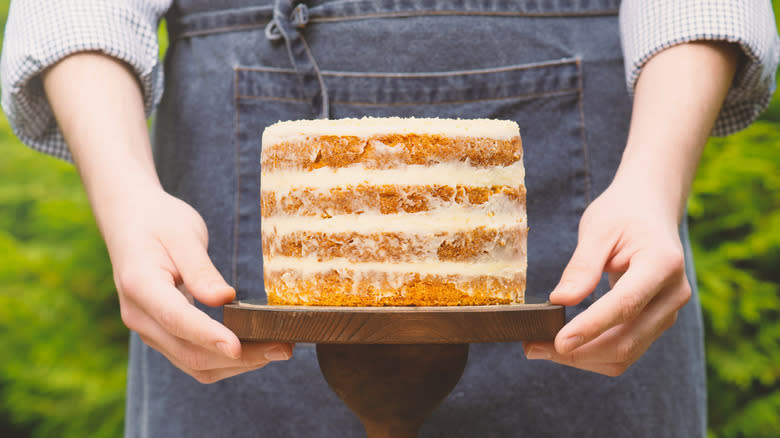 Woman holding naked cake