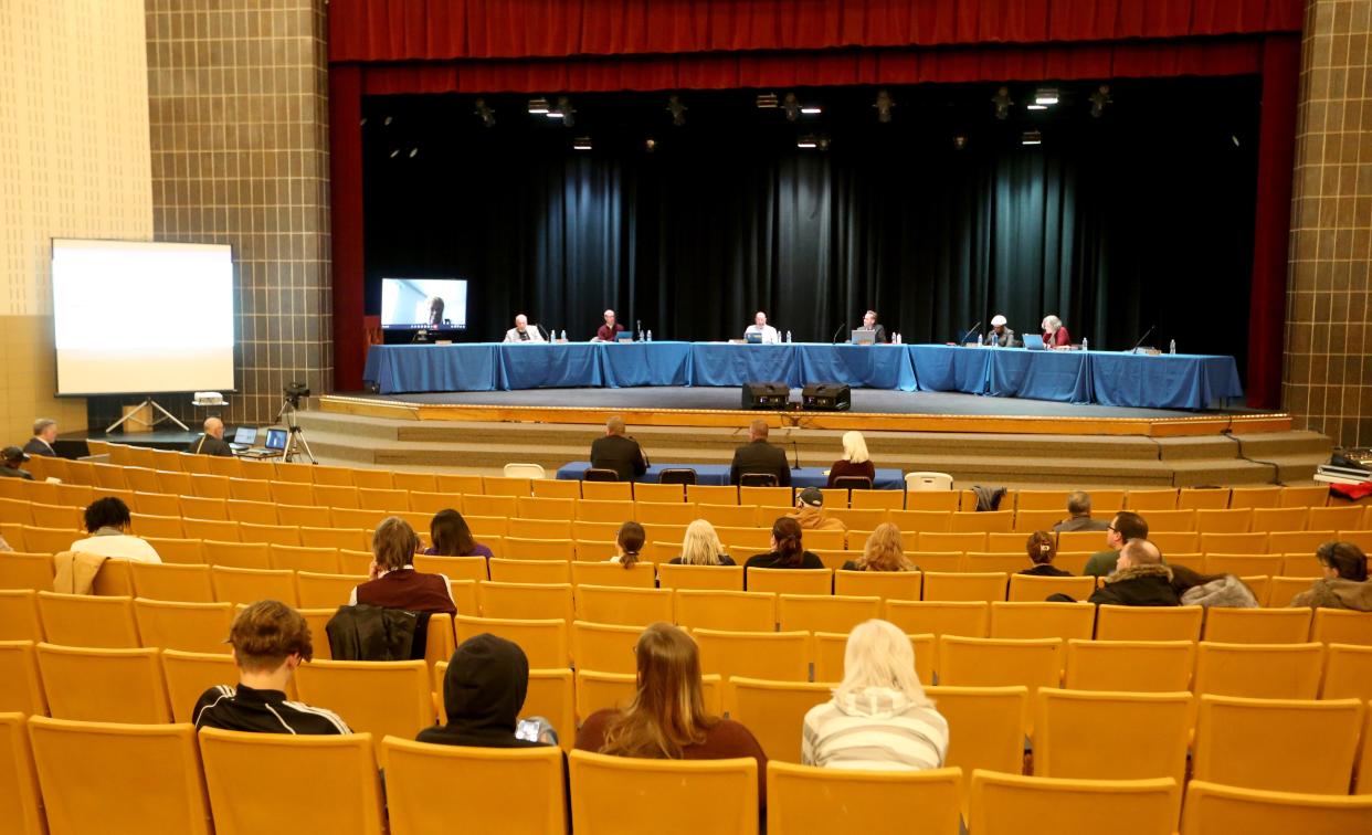 An audience listens to consultants discuss the district’s facilities study results At the South Bend school board meeting Monday, March 20, 2023, at Clay High School.  Consultants recommended closure of Clay High School and Warren School in its facilities study findings to the board.