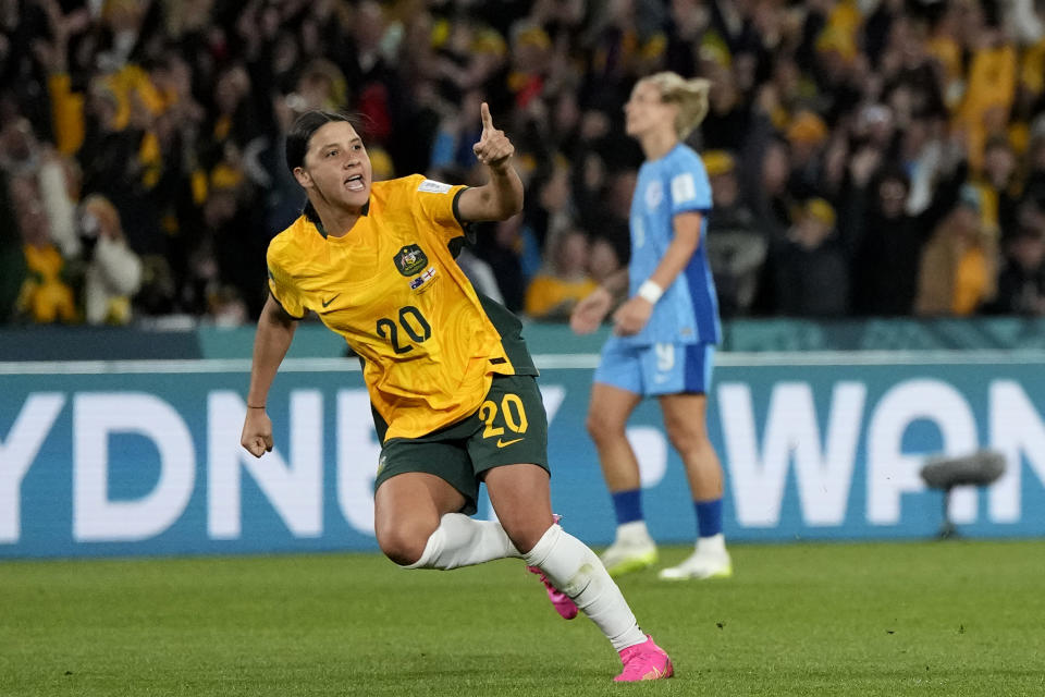 Australia's Sam Kerr celebrates after scoring her side's first goal during the Women's World Cup semifinal soccer match between Australia and England at Stadium Australia in Sydney, Australia, Wednesday, Aug. 16, 2023. (AP Photo/Rick Rycroft)