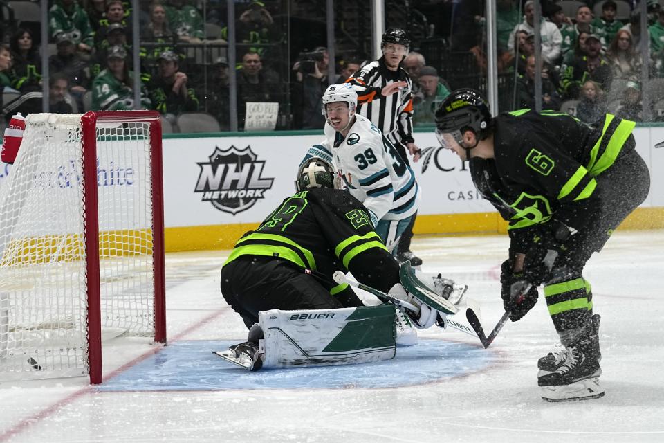 San Jose Sharks center Logan Couture (39) scores against Dallas Stars goaltender Jake Oettinger (29) as defenseman Colin Miller (6) looks on in the second period of an NHL hockey game in Dallas, Friday, Nov. 11, 2022. (AP Photo/Tony Gutierrez)