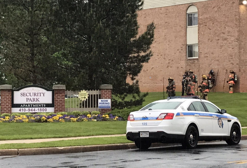 Police and fire crews at the scene of a shooting and residential fire in the Woodlawn neighborhood of Baltimore, which left several dead on May 8, 2021. (Amy Lu / via WBAL TV)