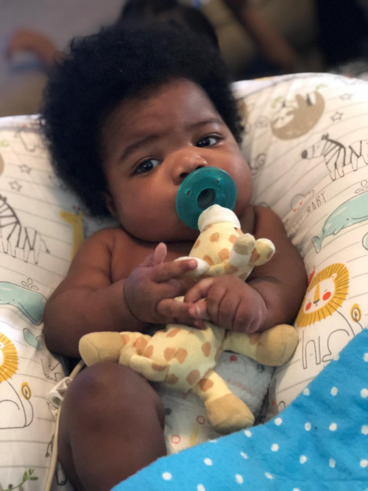 Dairess Fuller Jr., "DJ," happy and chubby at his home under the care and supervision of his aunt, LaMeka Lowe.