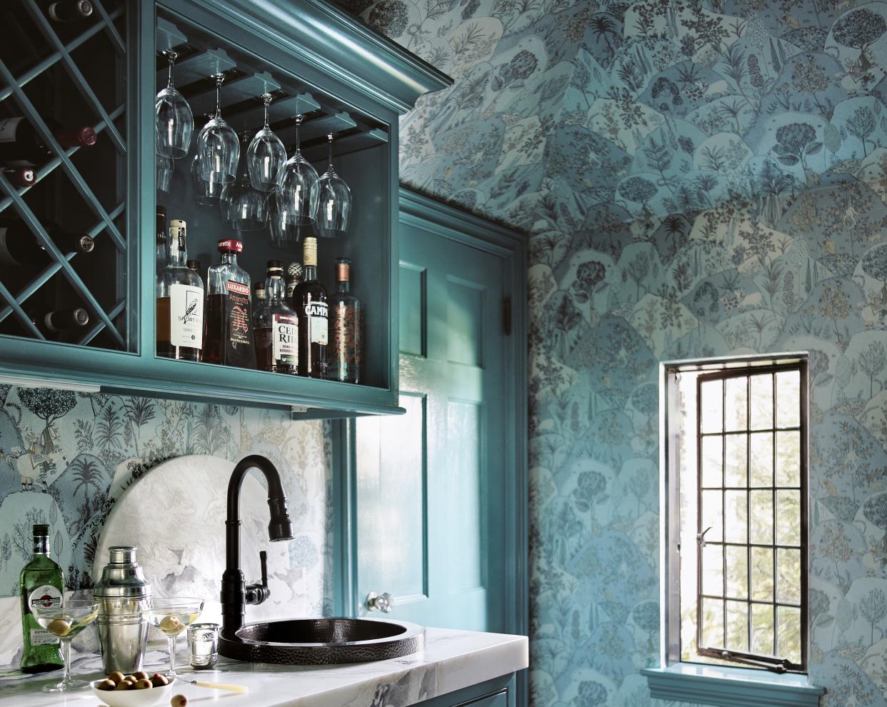  A wet bar furnished with paint and wallpaper. 