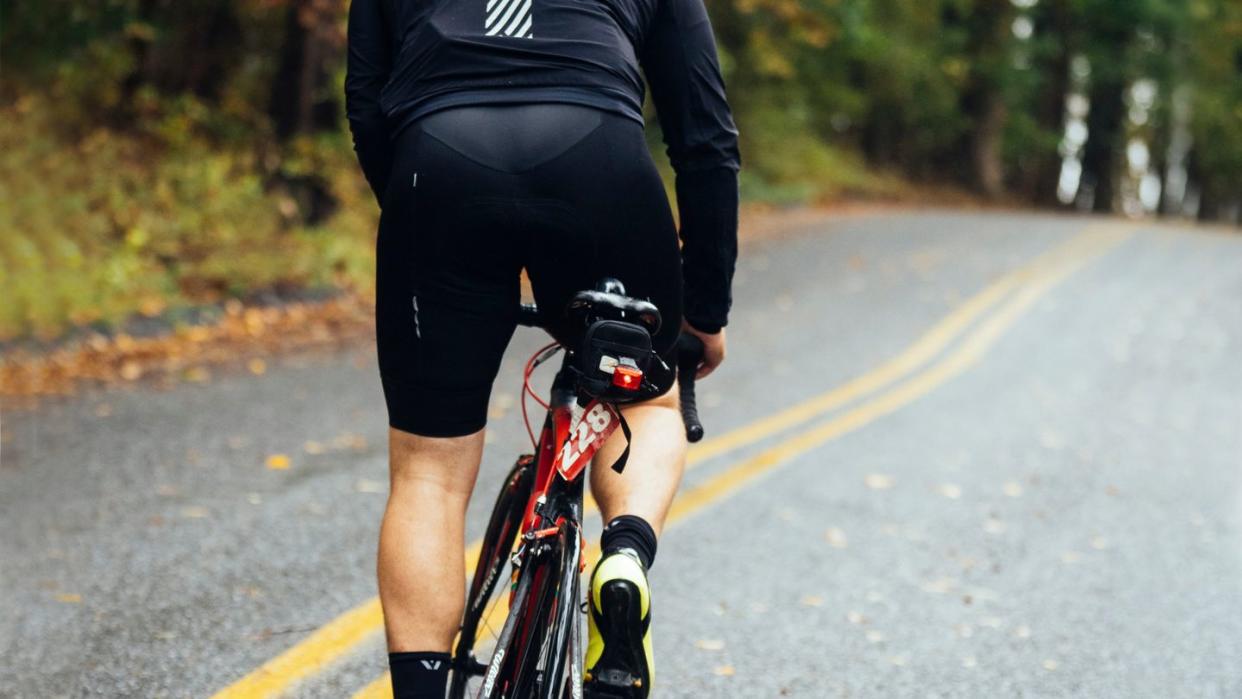 a man riding a bicycle on a road