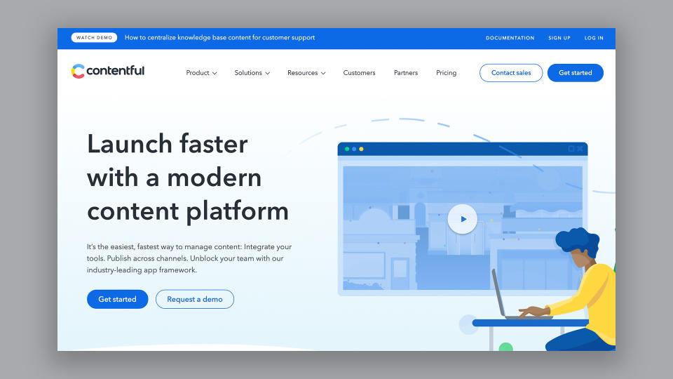 Homepage of Contentful, one of the best blogging platforms, featuring cartoon of person working on laptop