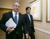 Plaintiff Michael Egan, right, with his attorney, Jeff Herman leave a news conference in Beverly Hills, Calif., Thursday, April 17, 2014. A sex abuse lawsuit by Egan, a former child model and aspiring actor is accusing "X-Men" franchise director Bryan Singer of sexually abusing him as a teenager in a federal lawsuit filed in Hawaii. Singer's attorney, Marty Singer, said in a statement that the claims are absurd and defamatory. (AP Photo/Damian Dovarganes)