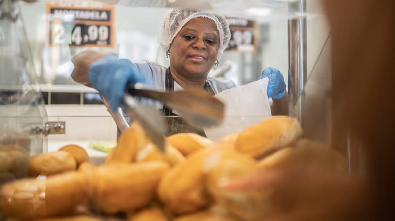 working grabbing bread