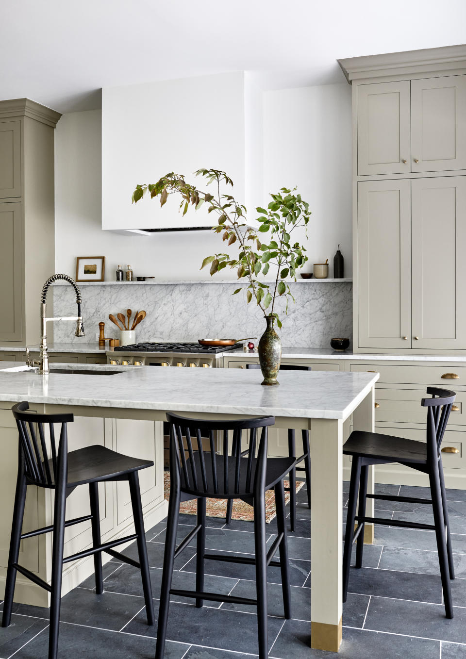 A kitchen with slate flooring