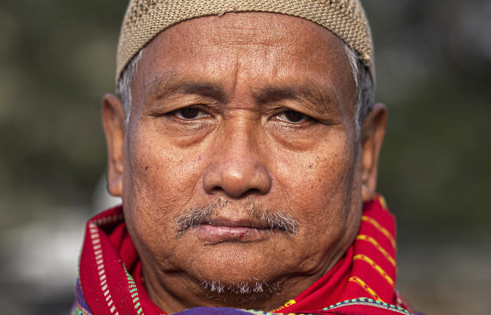 In this Monday, Dec. 23, 2019, photo, Kalparanjan Gogoi, 64, participates in a protest against the Citizenship Amendment Act (CAA) in Gauhati, India. Tens of thousands of protesters have taken to India’s streets to call for the revocation of the law, which critics say is the latest effort by Narendra Modi’s government to marginalize the country’s 200 million Muslims. Gogoi said he would oppose CAA till the day he dies, adding "I am ready to take a bullet in my head." (AP Photo/Anupam Nath)