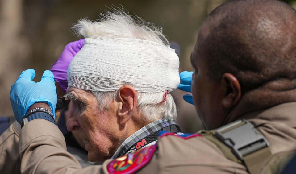 Texas Department of Public Safety troopers bandage up New York Times journalist David Montgomery's head during a peaceful, pro-Palestinian protest held at the University of Texas on Wednesday. Student organization Palestine Solidarity Committee organized the demonstration, which called for an end to the Israel-Hamas conflict.