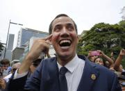 Opposition leader and self-proclaimed interim president of Venezuela Juan Guaido smiles while greeting supporters at the end of a rally in Caracas, Venezuela, Tuesday, July 23, 2019. The National Assembly approved on Tuesday the return of Venezuela to the Inter-American Treaty of Reciprocal Assistance (TIAR) to strengthen cooperation with the countries of the region and raise pressure against President Nicolás Maduro. (AP Photo/Ariana Cubillos)