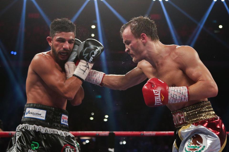 Dib (left) comes out of retirement to fight Khan. (Getty Images)