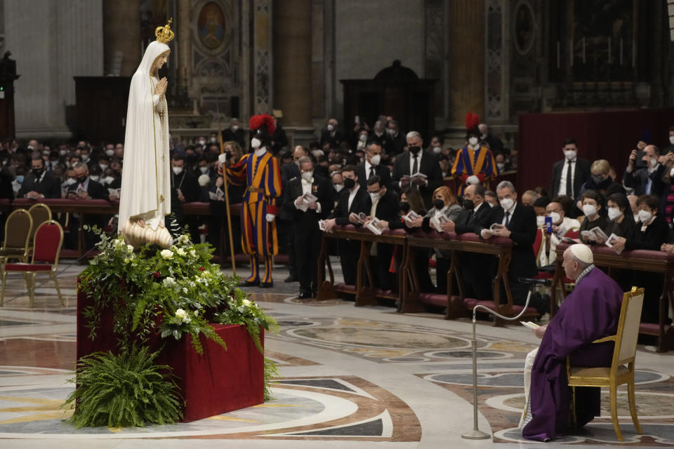 Pope Francis presides over a special prayer in St. Peter's Basilica at the Vatican, Friday, March 25, 2022. Francis is presiding over a special prayer for Ukraine that harks back to a century-old apocalyptic prophesy about peace and Russia that was sparked by purported visions of the Virgin Mary to three peasant children in Fatima, Portugal in 1917. (AP Photo/Gregorio Borgia)