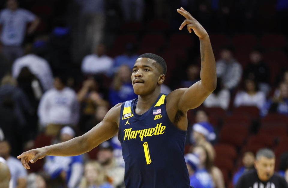 Marquette guard Kam Jones (1) reacts after making a 3-point basket against Seton Hall during the second half of an NCAA college basketball game in Newark, N.J., Saturday, Jan. 21, 2023. (AP Photo/Noah K. Murray)