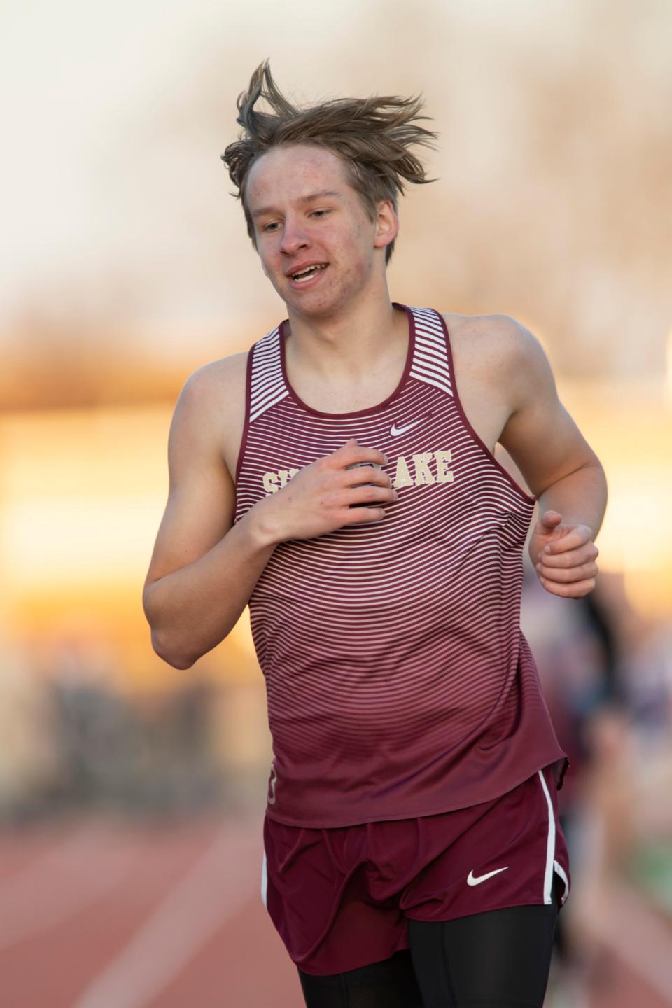 Silver Lake's Koltyn Kaniper crosses the finish line while competing in the men's 800m varsity event March 31 at Silver Lake High School.