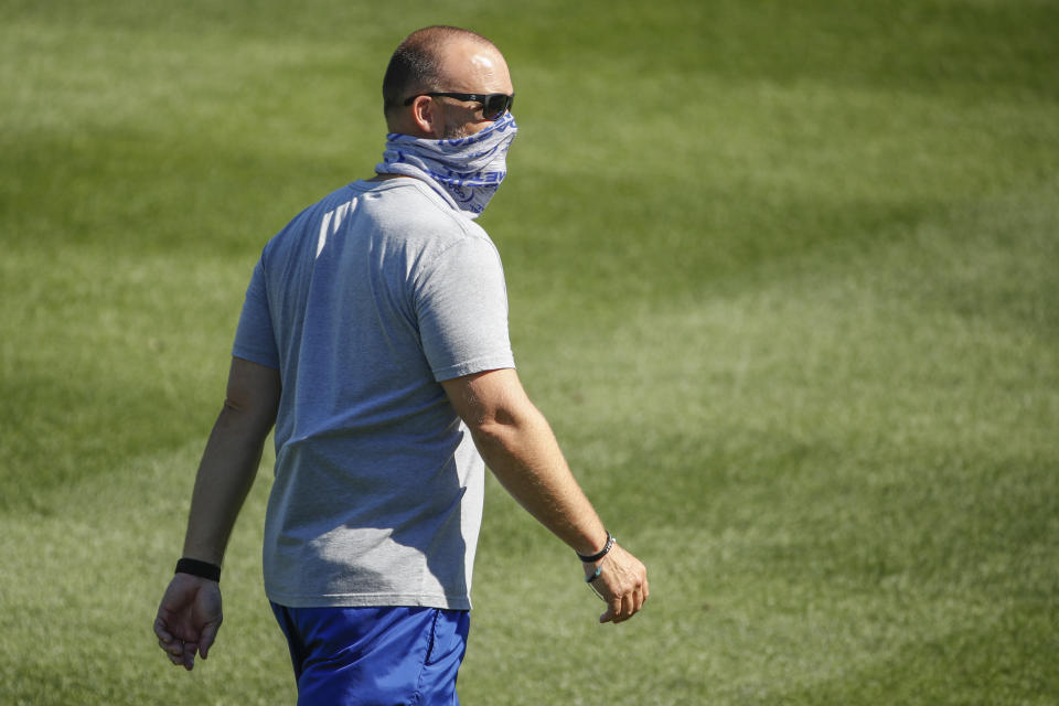 Chicago Cubs manager David Ross walks on the field during baseball practice at Wrigley Field on Friday, July 3, 2020 in Chicago. (AP Photo/Kamil Krzaczynski)