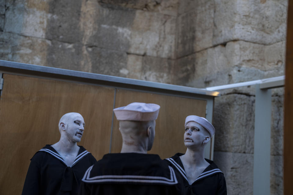 Performers prepare to go on stage at the Odeon of Herodes Atticus for a performance of "Madame Butterfly" in Athens, on Friday, June 1, 2023. The annual arts festival in Athens and at the ancient theater of Epidaurus in southern Greece is dedicated this year to the late opera great Maria Callas who was born 100 years ago. (AP Photo/Petros Giannakouris)