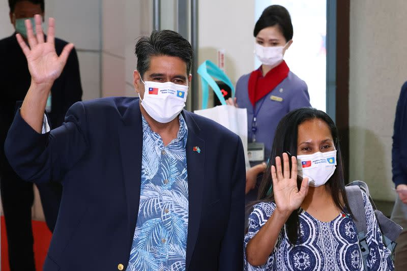 Palau President Surangel Whipps and his wife Valerie wave at Taoyuan International Airport