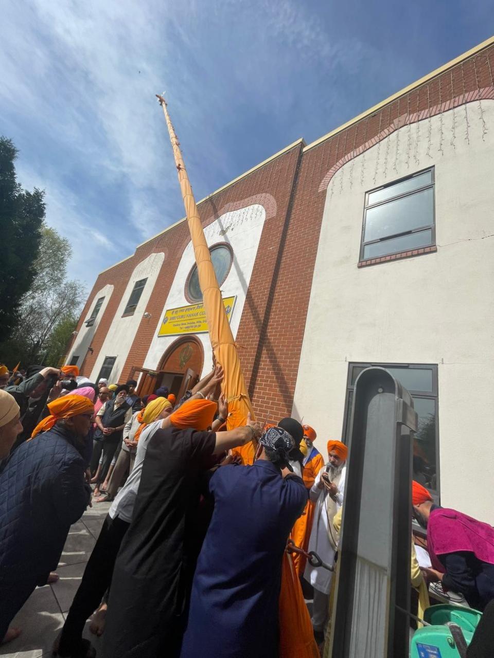 Swindon Advertiser: The changing of the Nishan Sahib