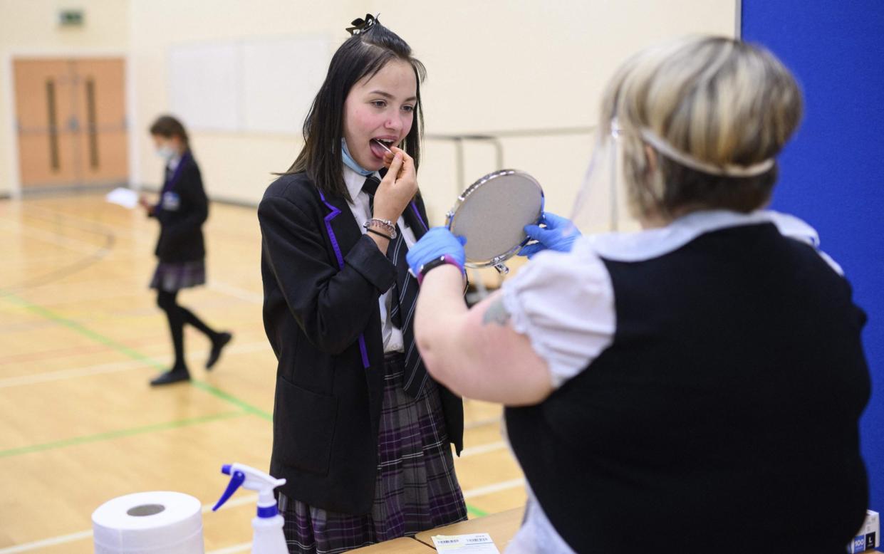 A student at Park Lane Academy in Halifax takes a Covid lateral flow test - OLI SCARFF/AFP via Getty Images