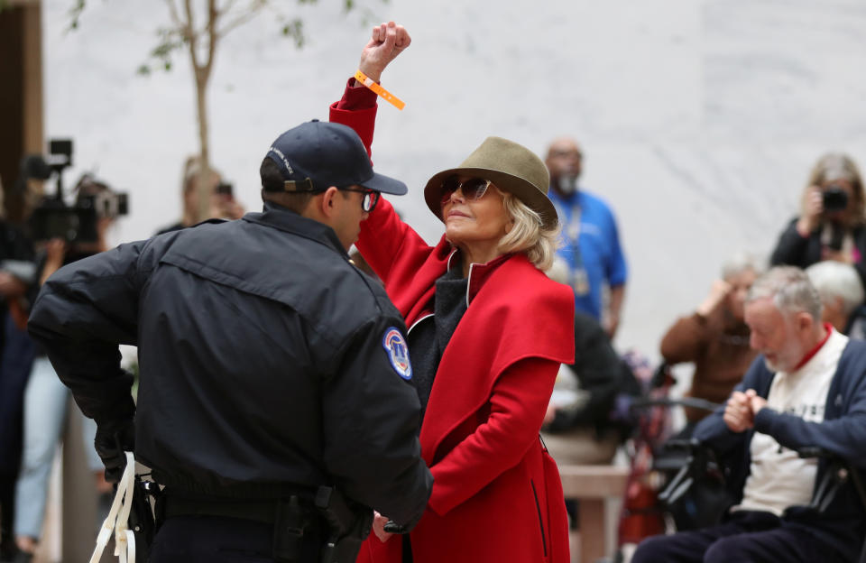 Jane Fonda is seen being arrested during a "Fire Drill Fridays" climate change protest in November. Now she's speaking out about her experiences, and going viral for a gay-rights discussion from 1979. (Photo: REUTERS/Siphiwe Sibeko)