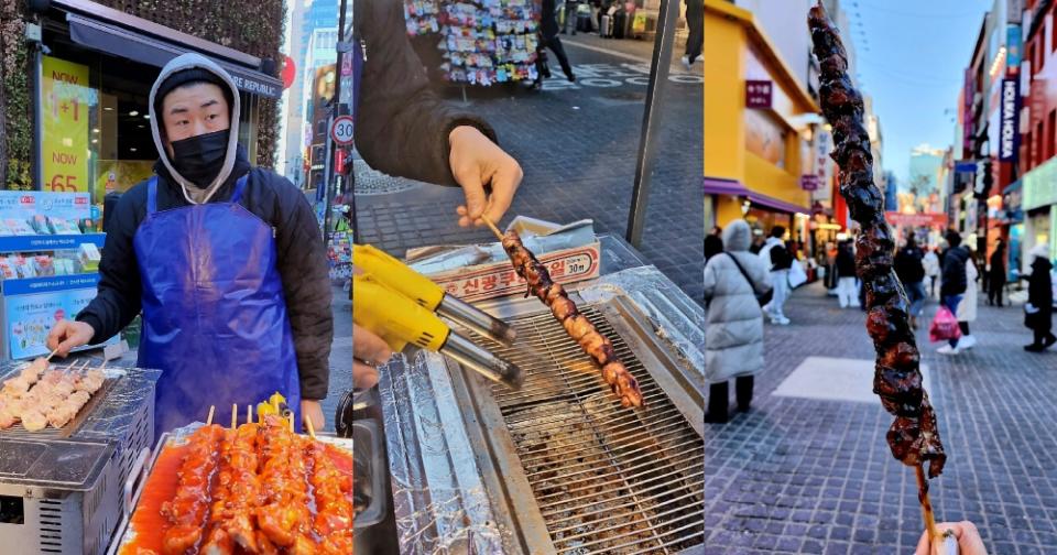 seoul - man selling skewers of meat