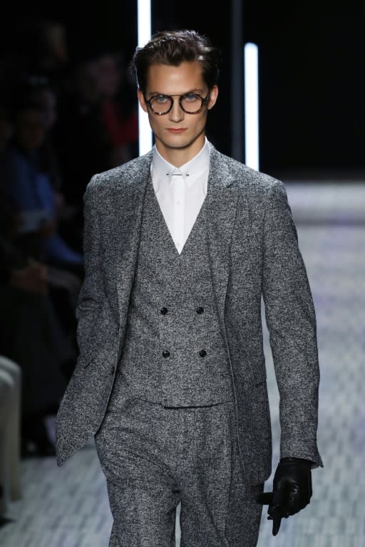 A model presents a creation by Cerruti during men's Fashion Week for the Fall/Winter 2017/2018 collection in Paris on January 20, 2017