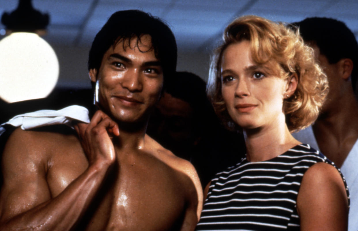 Lee and Lauren Holly in a scene from Dragon: The Bruce Lee Story. (Photo: Universal/Courtesy Everett Collection)